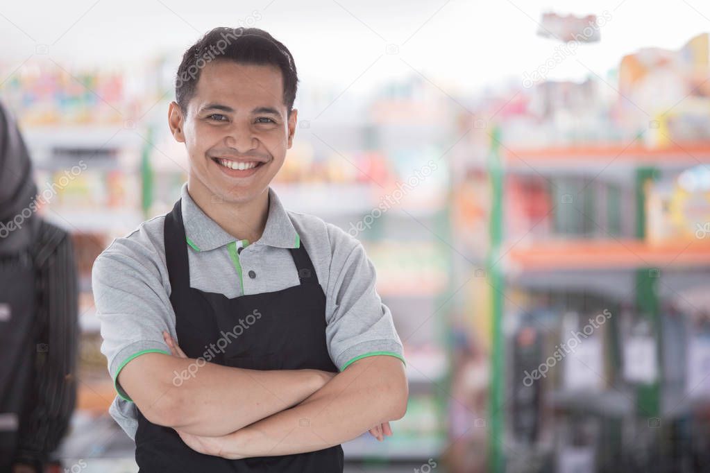  happy asian male shopkeeper
