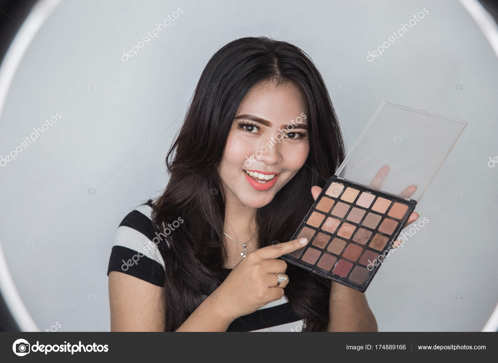 Woman Showing Makeup Tutorial Stock Photo Odua 174889166