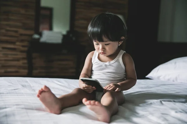 Adorable baby playing mobilephone — Stock Photo, Image