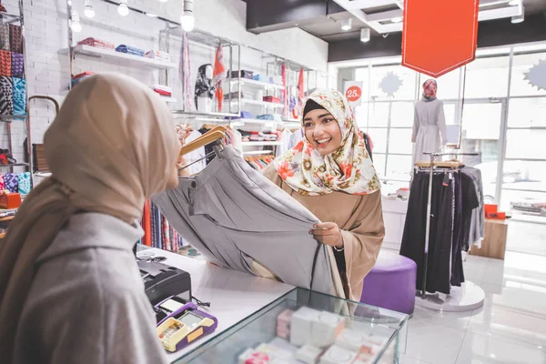 Customer purchasing some clothes — Stock Photo, Image