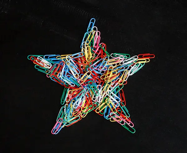 Star shaped colorful paper clips — Stock Photo, Image