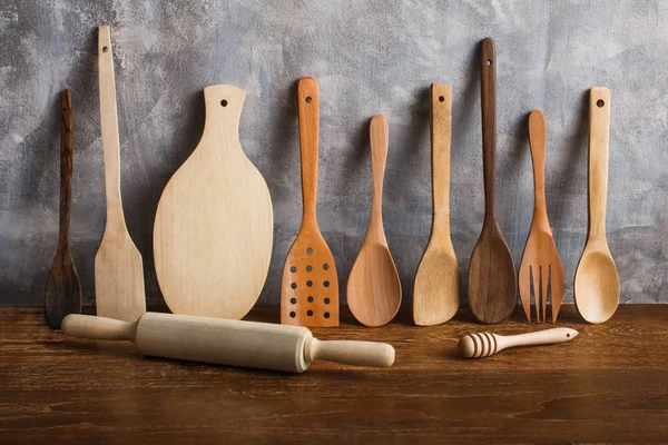 different wooden kitchen tools on the table