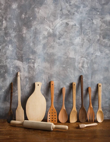 different wooden kitchen tools on the table