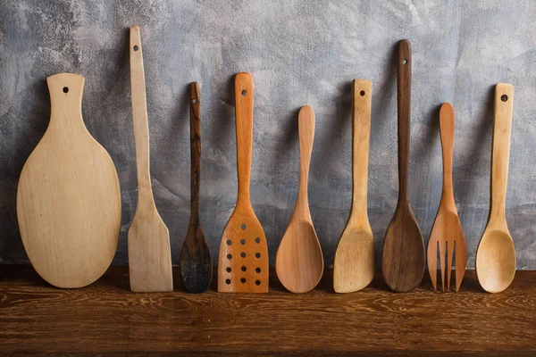 different wooden kitchen tools on the table