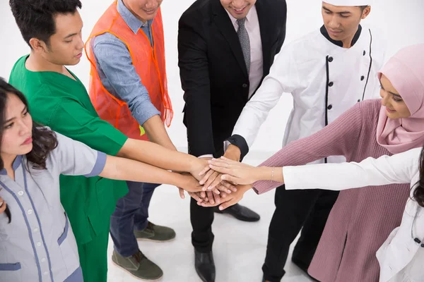 Various professions people put hands together — Stock Photo, Image