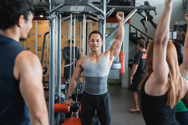 Asian man warm up shoulders for working out — Stock Photo, Image