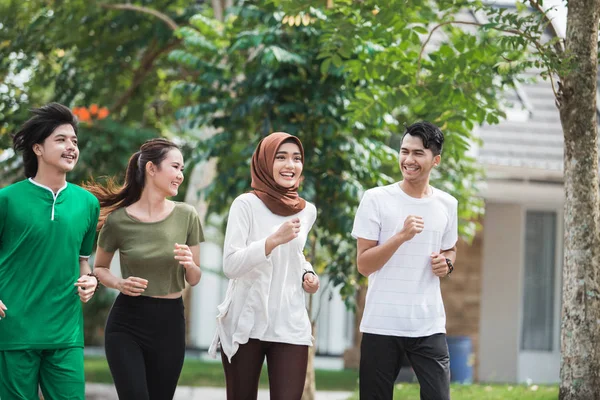 Happy young asian people exercise and warm up — Stock Photo, Image