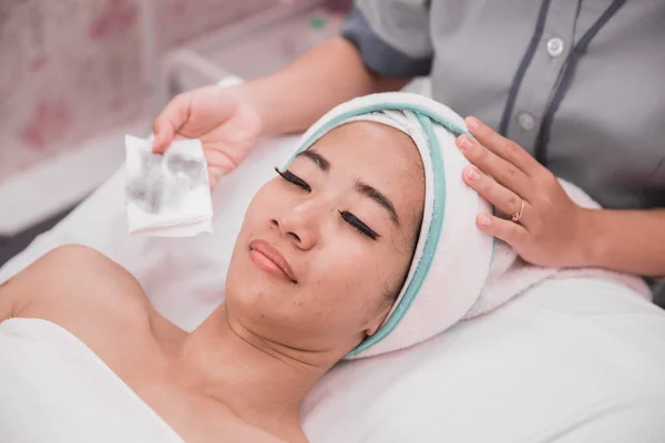 woman facial care in beauty salon and spa