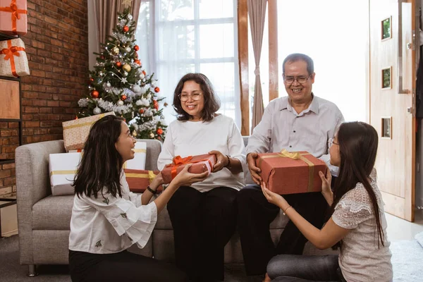 asian family gift exchange tradition on christmas