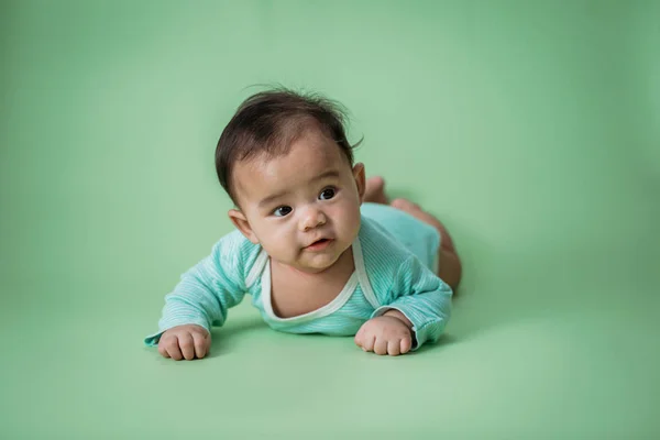 Tummy time cute baby in studio — Stock Photo, Image