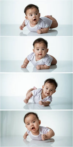 Baby laying on her belly in studio — Stock Photo, Image