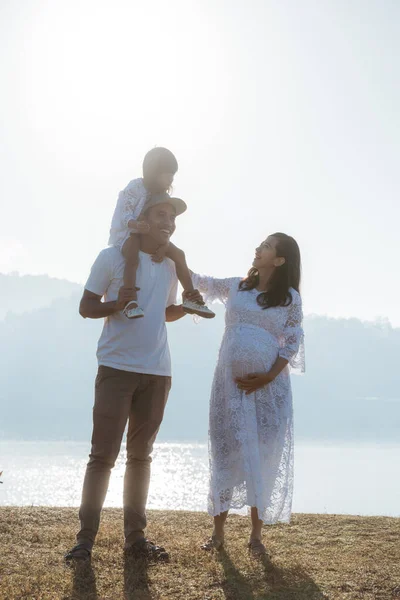 Asian family having fun at sunrise — Stock Photo, Image