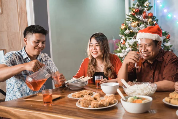 family having christmas eve dinner