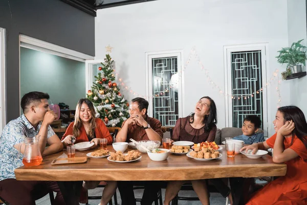 family having christmas eve dinner