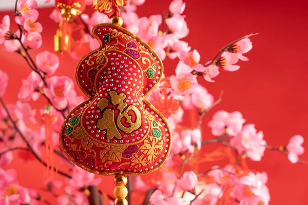 Chinese new year accessories hanging on the branch — Stock Photo, Image