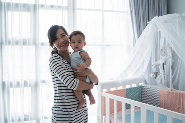 Asian happy baby on the crib — 스톡 사진