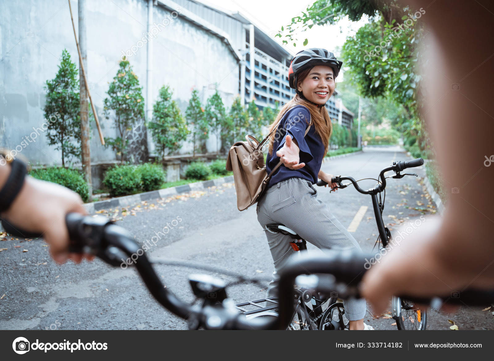 Young woman is ready to go on her folding bike and lend a hand to