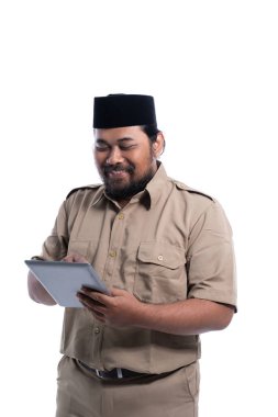 happy indonesian government worker using tabletp pc