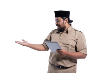 asian worker with brown uniform presenting to copy space