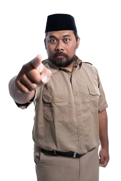 Serious face of male with khaki uniform pointing to camera — ストック写真