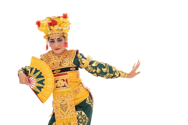 Balinese dancers hold a fan — Stock Photo, Image