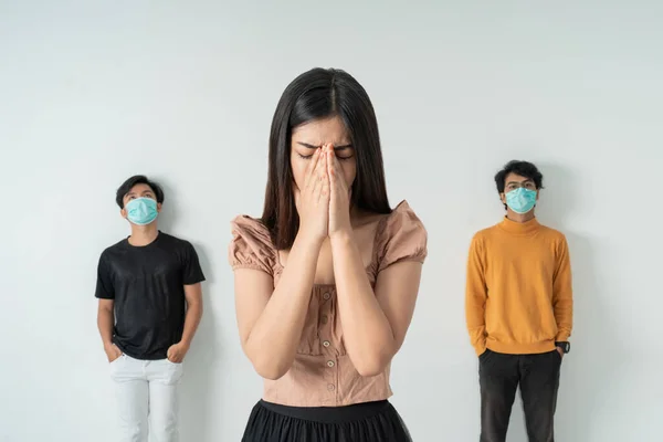 worried woman surrounded by sick people