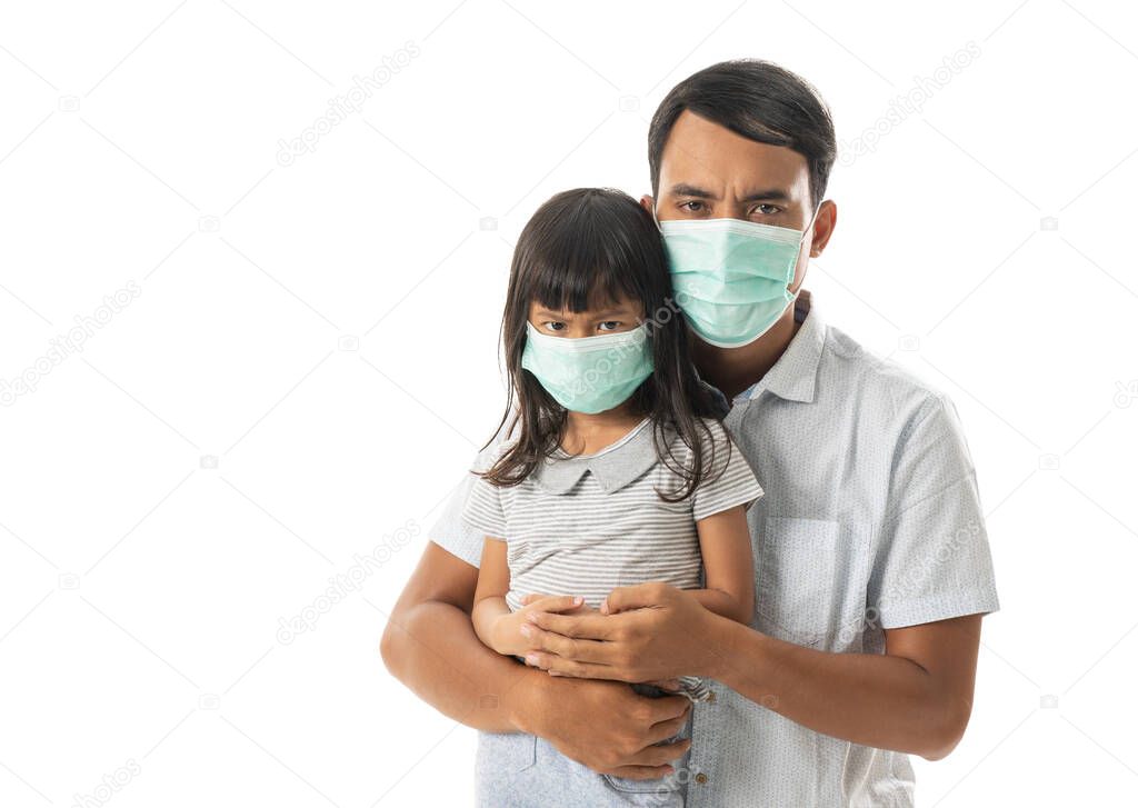 father and daughter wearing face masks