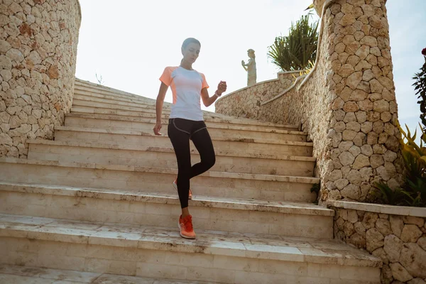 Runner athlete running on stairs — Stock Photo, Image