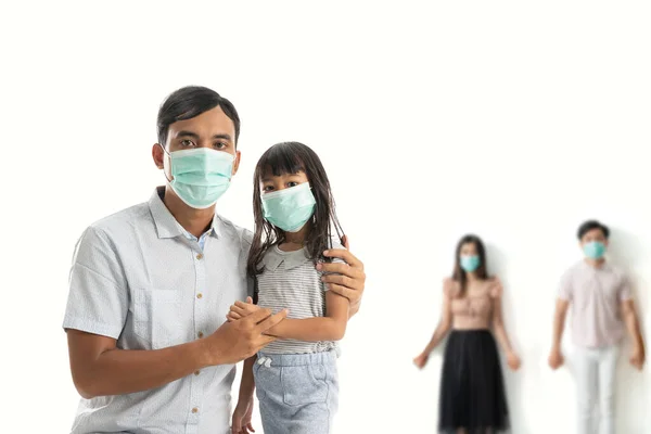 father and daughter wear masks for protection