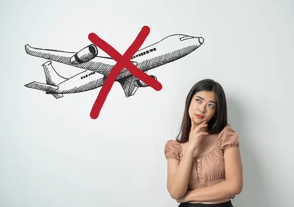 Asian woman with airplane with red crossed stop vacation — Stock Photo, Image