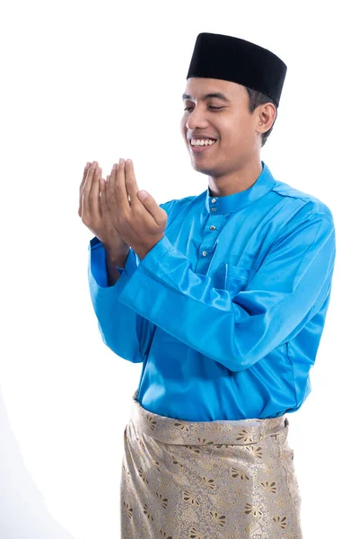 Male muslim with head cap praying to god — Stock Photo, Image