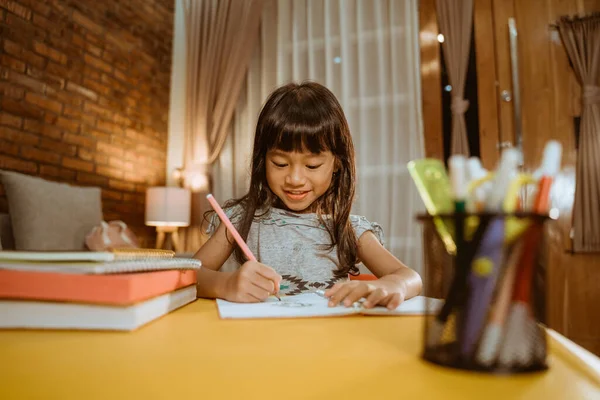 Child studying at home in the evening — Stock Photo, Image