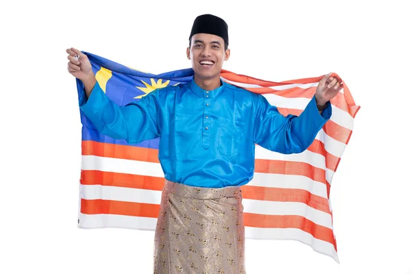 Animado malaysian masculino muçulmano com bandeira — Fotografia de Stock