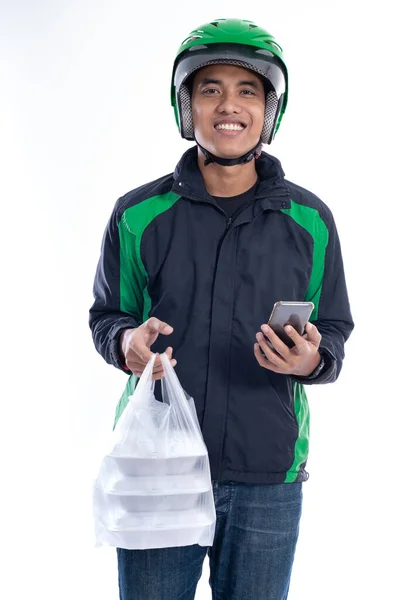 Man with uniform jacket and helmet delivering food — Stock Photo, Image