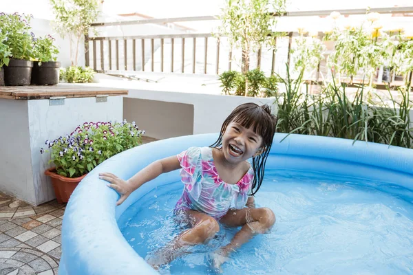 Kid swim in inftable pool — Stock Photo, Image