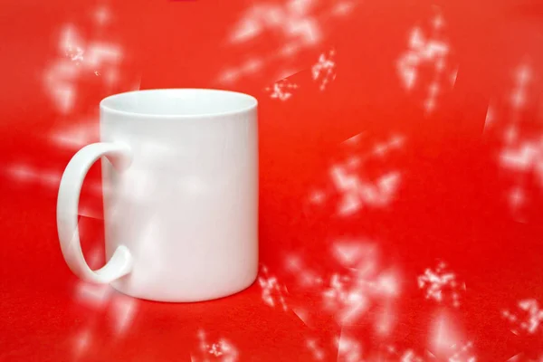 White mug on red background with effects. Copy space for writing. White glass isolated. White Effects