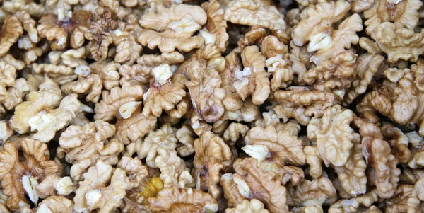 Peeled walnuts full frame photo. Walnuts pattern. Kernels.