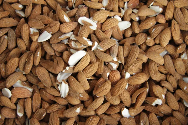 Peeled almonds full frame photo. Almonds. Nuts pattern.