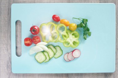 Colorful vegetables on cutting board with copy space