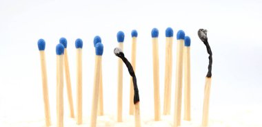 New matches around a burnt one. Stress burnout concept.