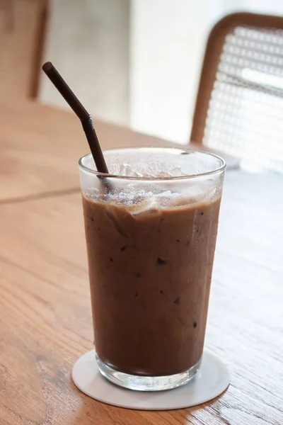 Iced coffee in coffee shop on wooden table — 스톡 사진