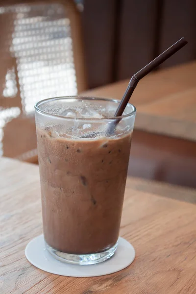 Iced coffee in coffee shop on wooden table — 스톡 사진