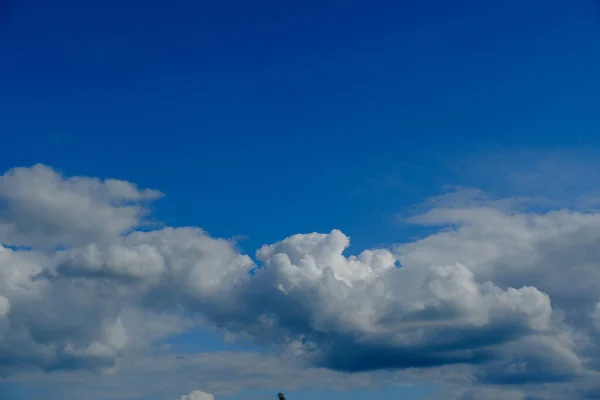 blue sky with clouds at noon