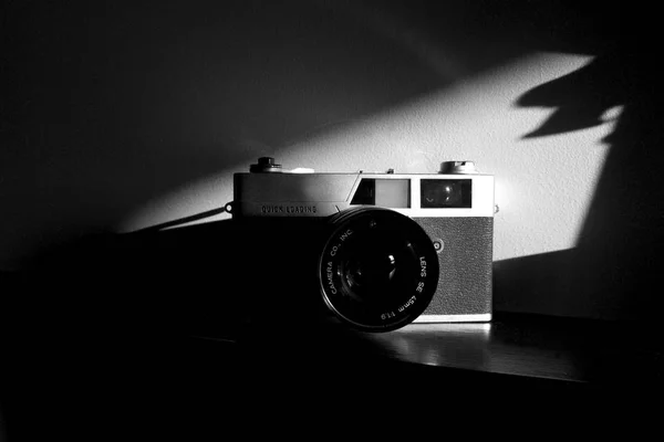 film camera, retro,35mm film vintage look, Black and white photograph, studio photograph