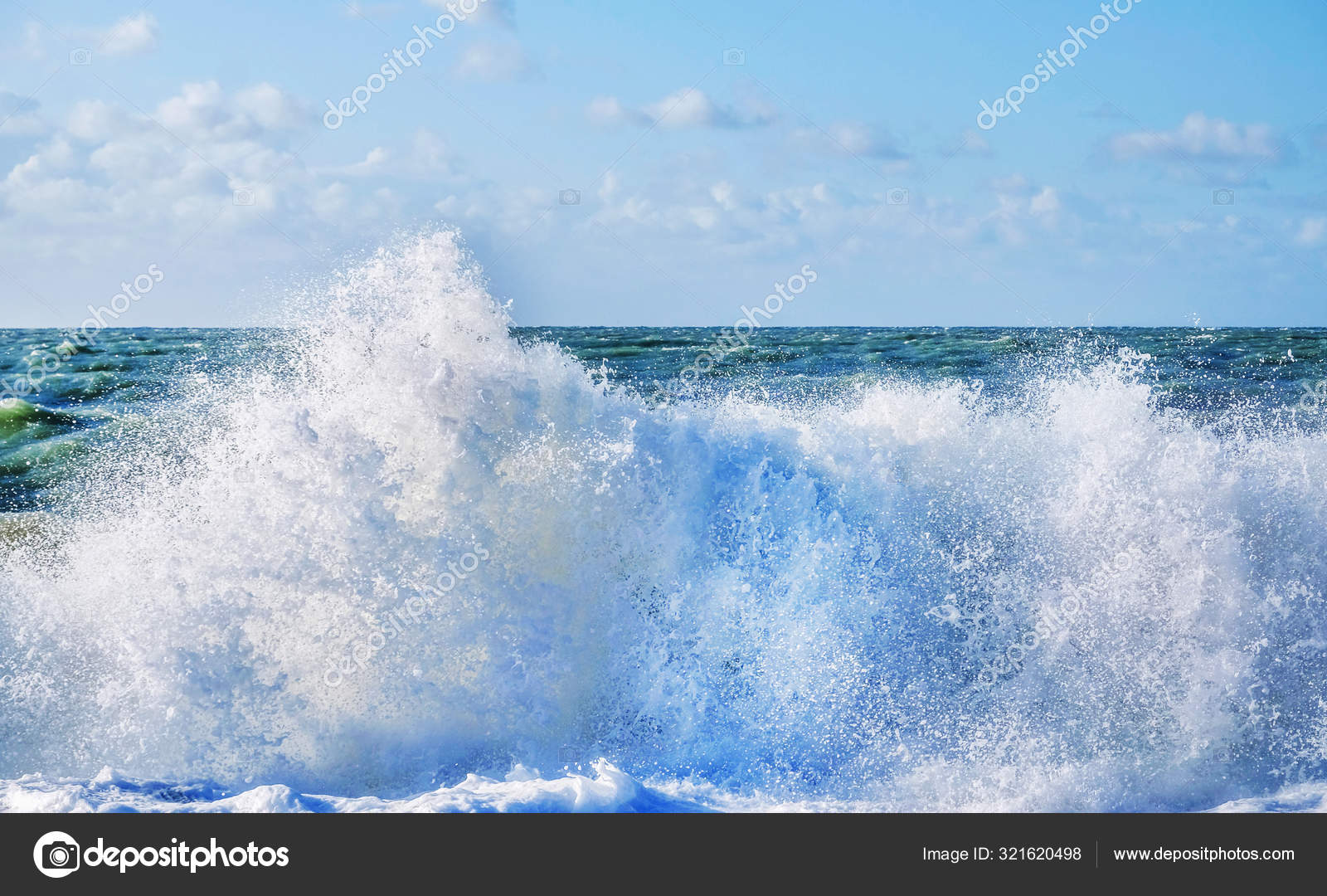 White spray of a wave breaking on the beach with a rough sea and — Stock  Photo © gill@gillcopeland.com #321620498, image size:1600x1080