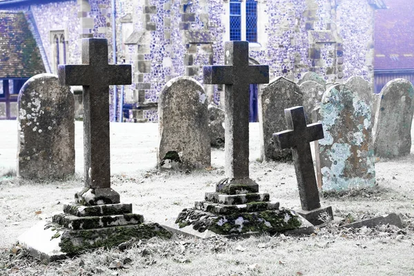 Scarey grave yard with ano old church behind black and white pho — Stock Photo, Image