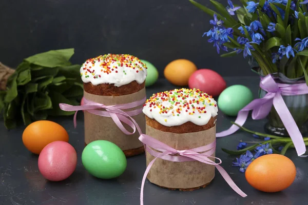 Still life of Easter cakes, painted eggs and forest snowdrops on dark background, Horizontal orientation — Stock Photo, Image
