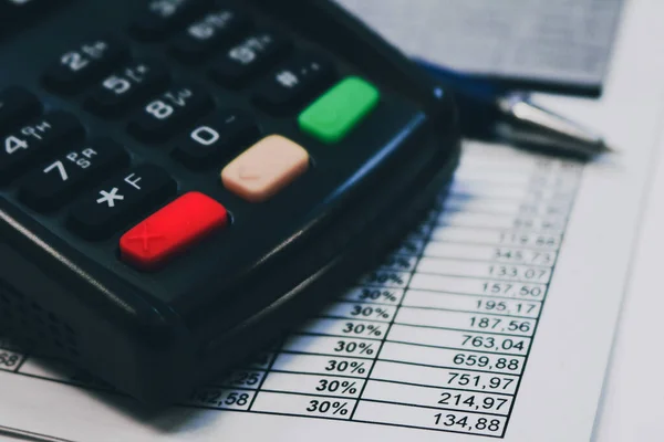 Calculator and tax paper close up