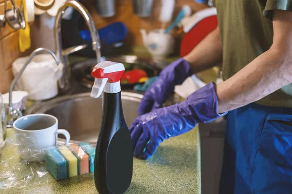 Man in protective purple gloves — Stock Photo, Image