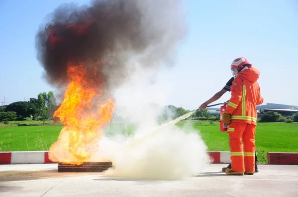 Instructor training how to use a fire extinguisher